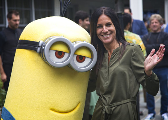 One of Illumination’s “Minions” poses with a Spring Spectacle guest