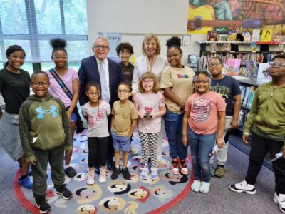 Ohio Governor Mike DeWine and First Lady Fran DeWine pose with students from Oxford Elementary who just received a brand new pair of glasses.