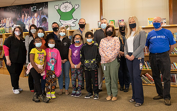 Greenwood Elementary Student celebrating their new glasses.