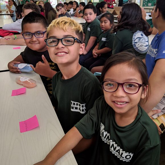 Student at WEIS show off new glasses