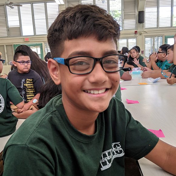 Student at WEIS shows off new glasses