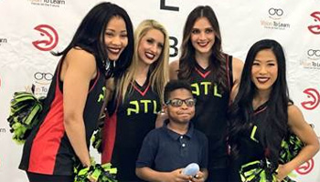 Atlanta Hawks Cheerleaders with student