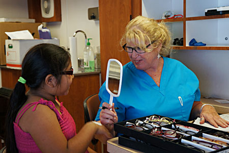 child selecting her eye glass frames