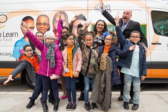 Darren Mischel, Frank R. Conwell Primary School Principal, helps some of his students celebrate the day.