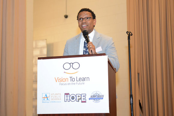 KIPP Ways Academy School Leader Dwight Ho-Sang addresses the crowd as students wait for their glasses, April 25, 2018.
