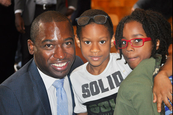 Mayor Levar Stoney with two kids who received glasses at Elizabeth D. Redd Elementary School in Richmond, October 2017.