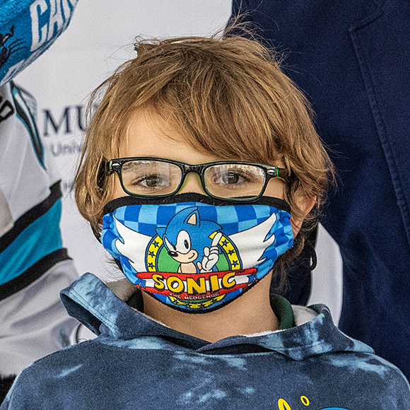 Masked student with new glasses